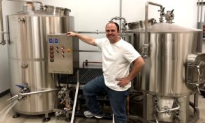 Raymond Miller, Brewmaster of Vizsla Brewing with his Brewhouse